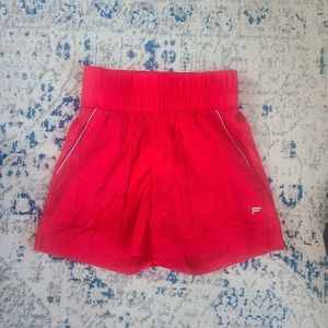Womens fabletics high waisted shorts nylon shorts size small. Red
